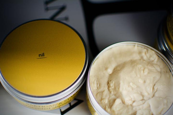 Bartigan and Stark unscented shave soap Nil yellow label on metal tin and and opened tin revealing shave soap